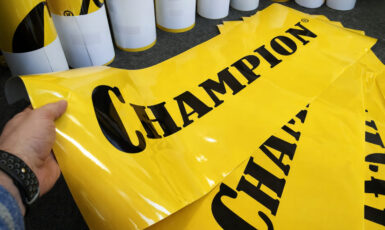 Печать глянцевых наклеек для автомобильной компании "Champion" по цене от 200 руб/м2, заказать дешево в Москве🔥